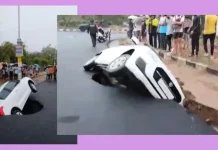 A car stuck in a big pothole on the road;  Viral video-oneindia news